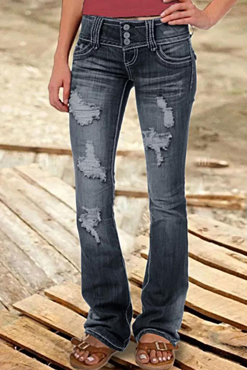 Vaqueros rasgados de tiro alto con corte de bota y diseño de patchwork callejero