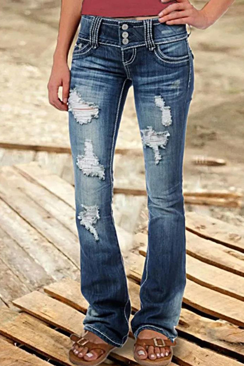 Vaqueros rasgados de tiro alto con corte de bota y diseño de patchwork callejero