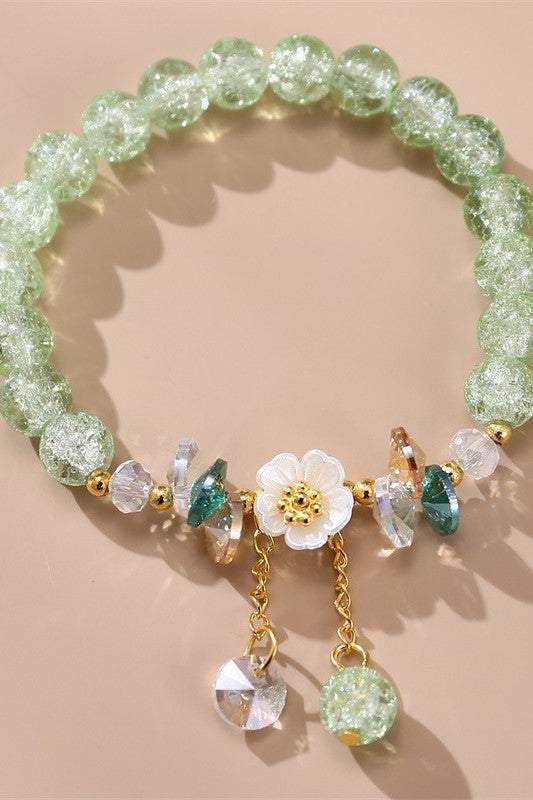 Pulsera de cuentas de vidrio de colores con diseño floral