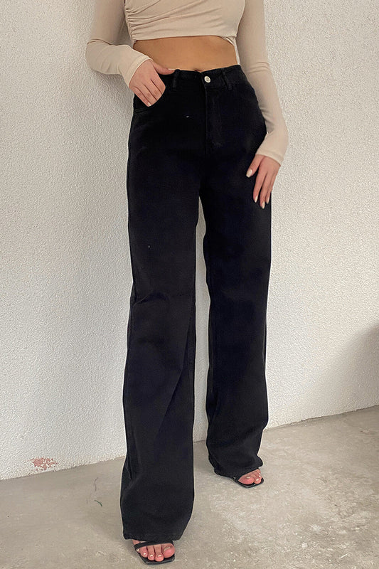Vaqueros de mezclilla de cintura media con bolsillos lisos y sencillos de estilo casual